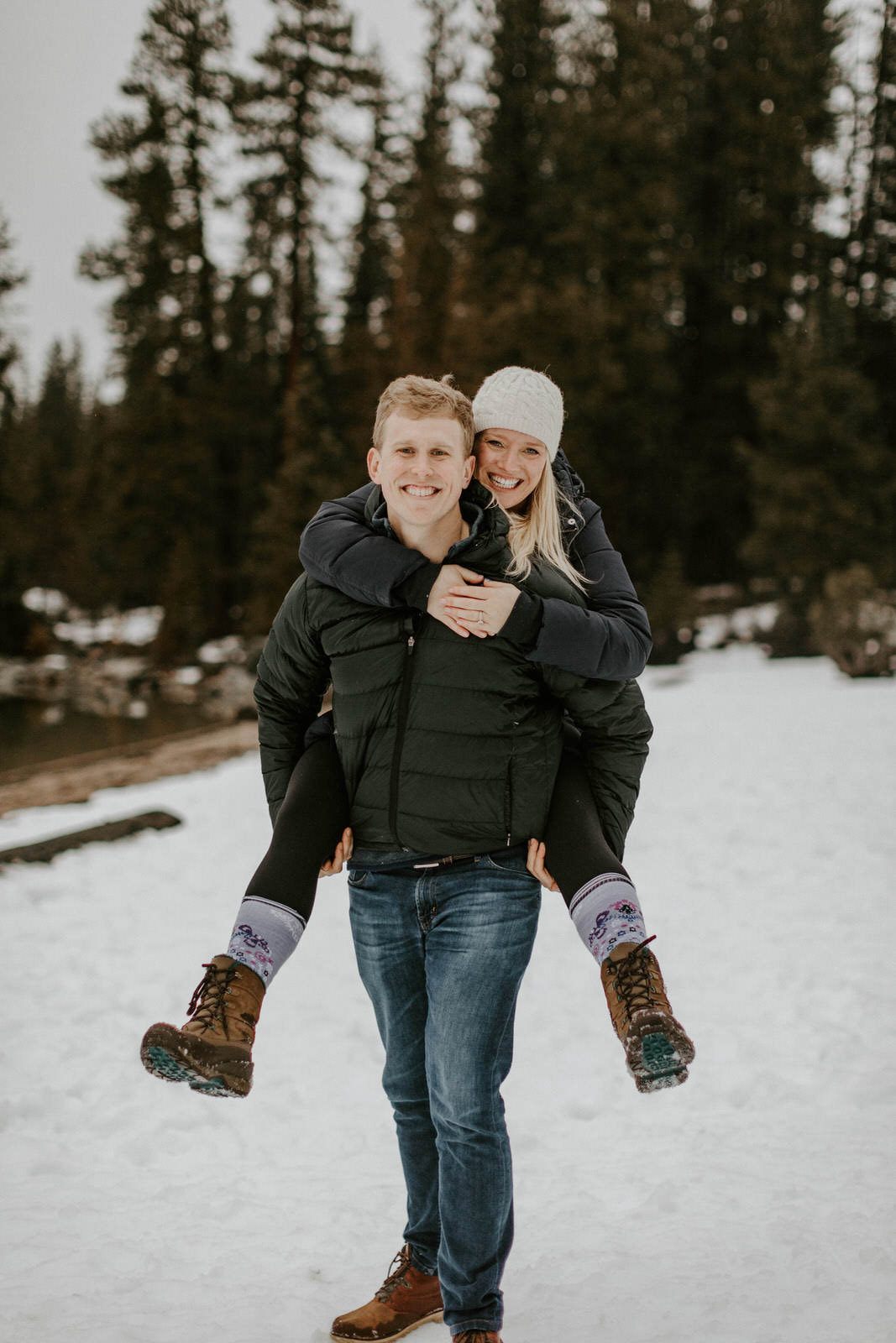 Couple embracing during golden hour near their PNW cabin