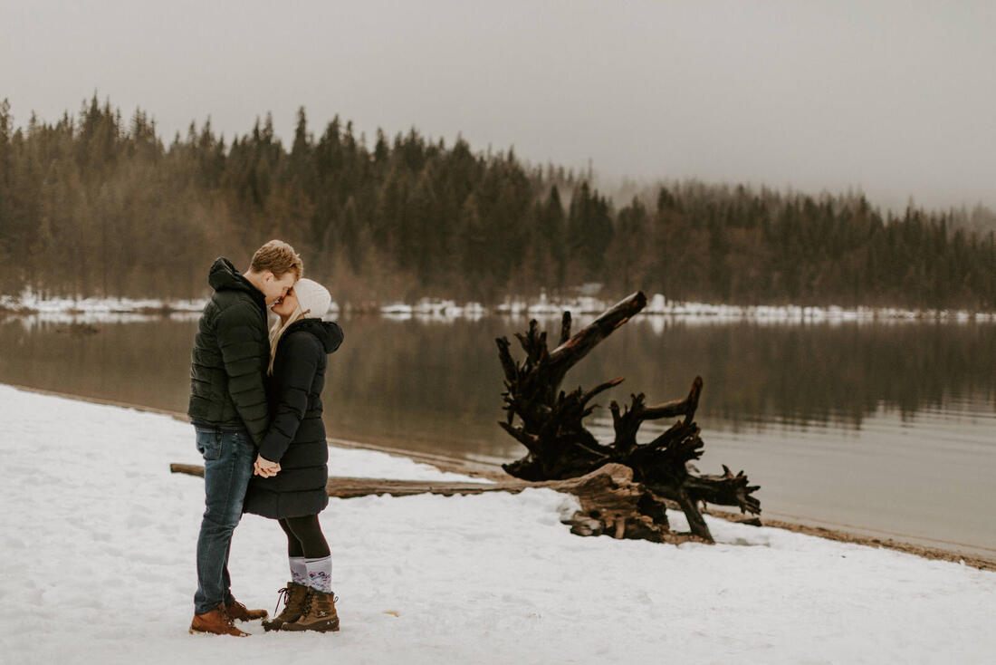 Candid moment of a couple laughing together outdoors