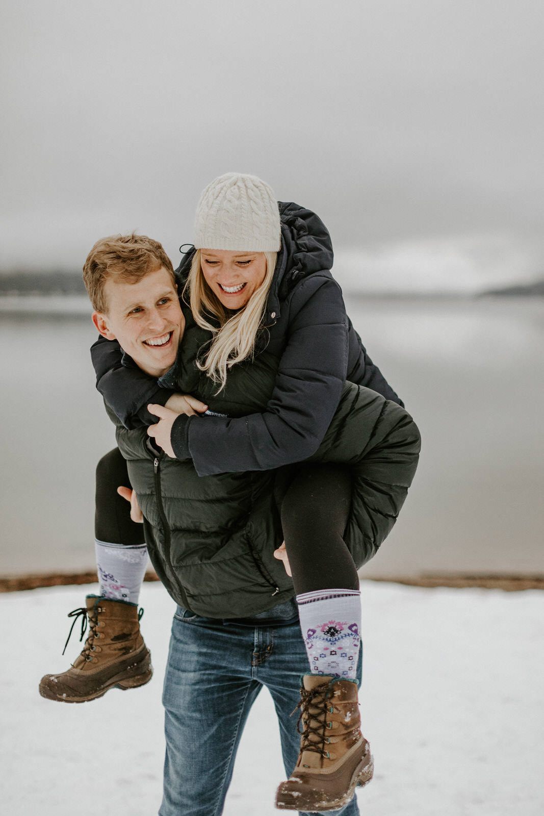 Couple walking away from the camera toward their a-frame cabin