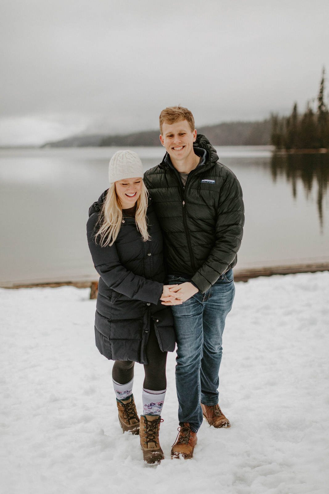 Couple standing together as evening light settles over the cabin