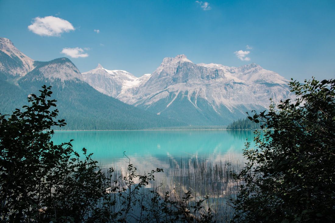 Snow-capped peaks above a turquoise lake in Banff, Alberta