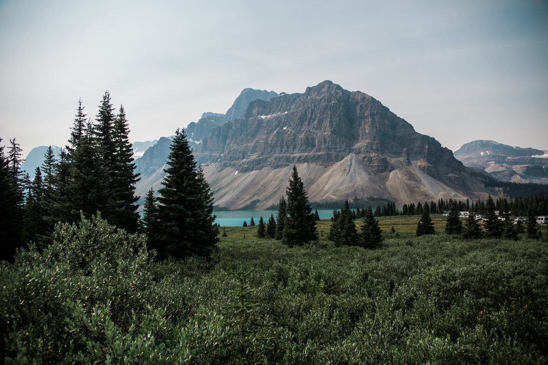 Snow-capped peaks above a turquoise lake in Banff, Alberta
