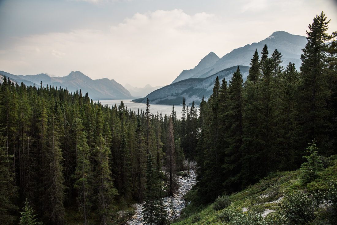 Aerial helicopter view over glacier-fed lakes in Banff National Park
