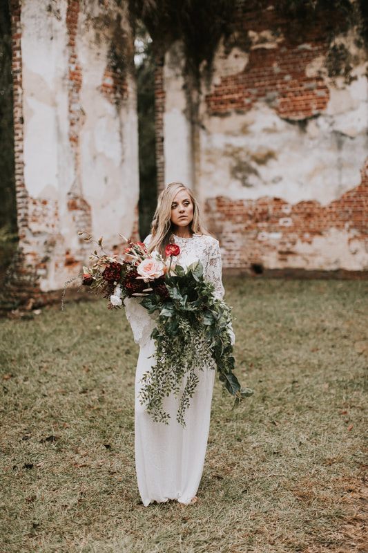 Bridal portrait highlighting the textured sleeve layer added over a simple white gown.