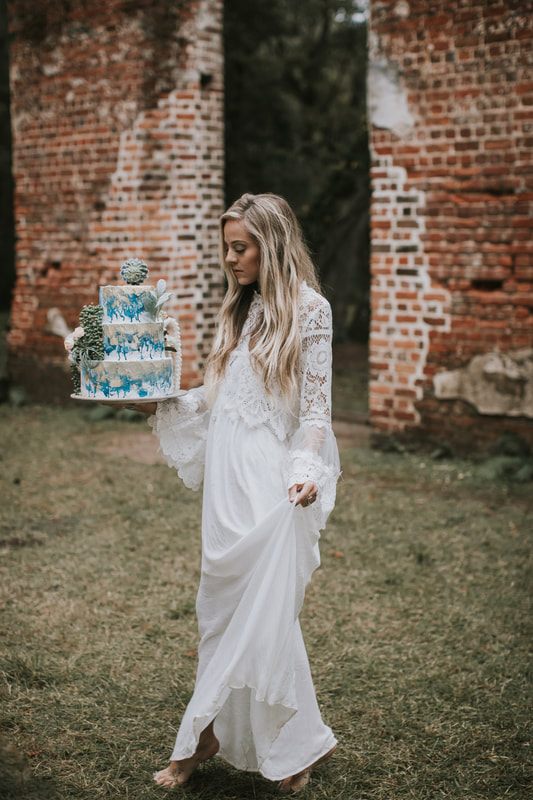 Charleston bridal portrait featuring dark red and purple floral styling with a moody, textured look.