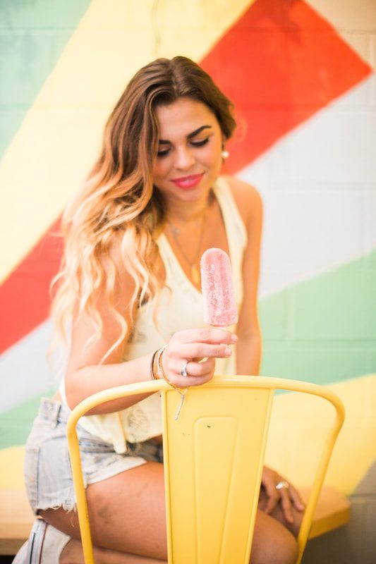 Lindsay modeling in a colorful Christmas-in-July concept shoot in Charleston