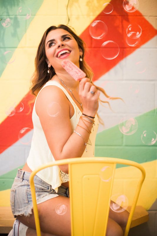 Styled portrait featuring Crooked Crown alcoholic popsicles in downtown Charleston