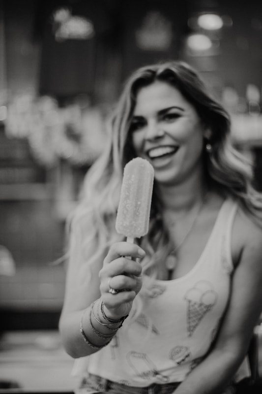 Styled portrait featuring Crooked Crown alcoholic popsicles in downtown Charleston