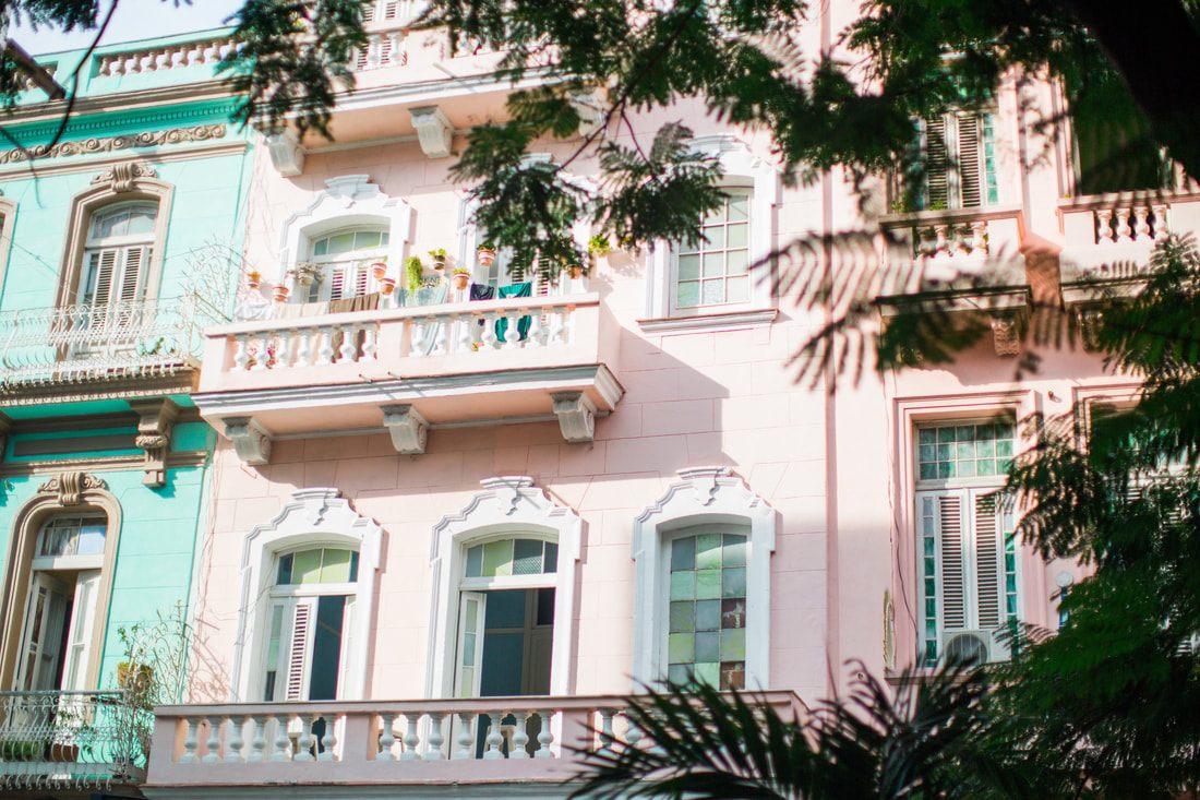 Peeling pastel colonial facade along a Havana street in Cuba