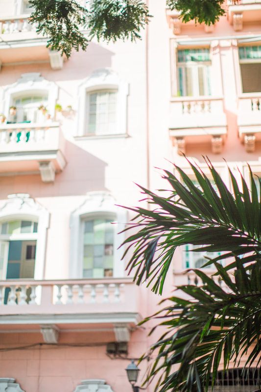 Local life on a narrow cobblestone street in Old Havana, Cuba