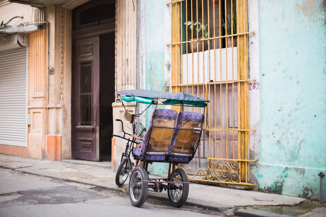 Close-up detail of a restored vintage car in Havana's colorful streets