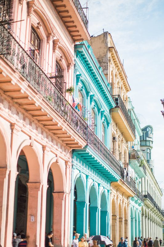 Peeling pastel colonial facade along a Havana street in Cuba