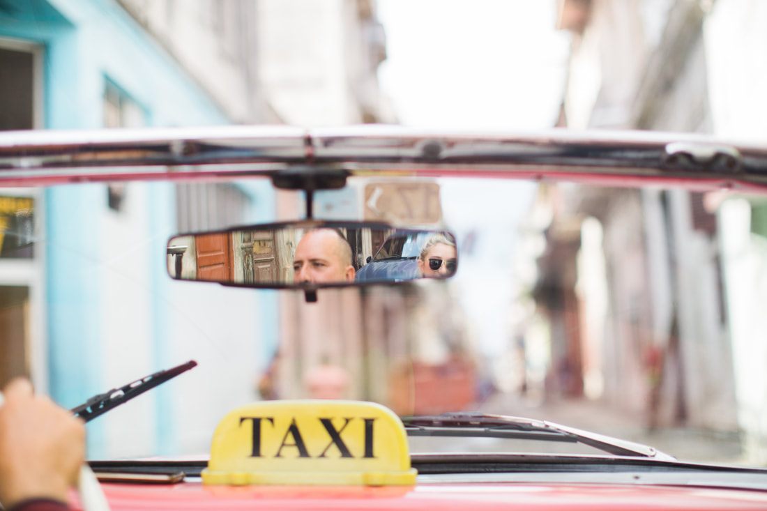 Classic 1950s car cruising the Malecon waterfront in Havana