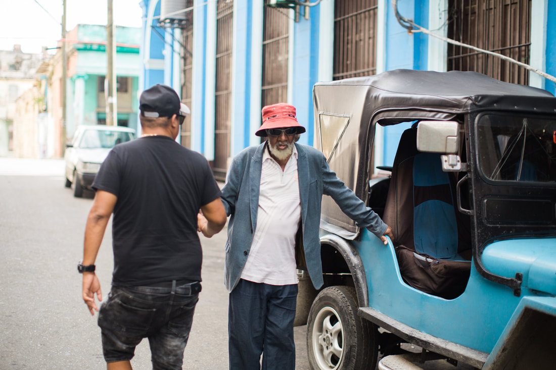 Close-up detail of a restored vintage car in Havana's colorful streets