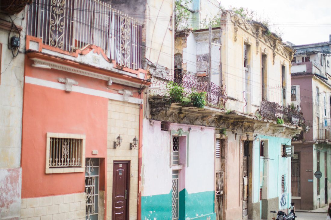 Peeling pastel colonial facade along a Havana street in Cuba