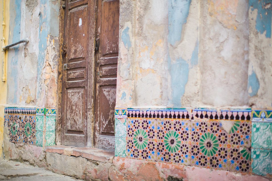 Close-up detail of a restored vintage car in Havana's colorful streets