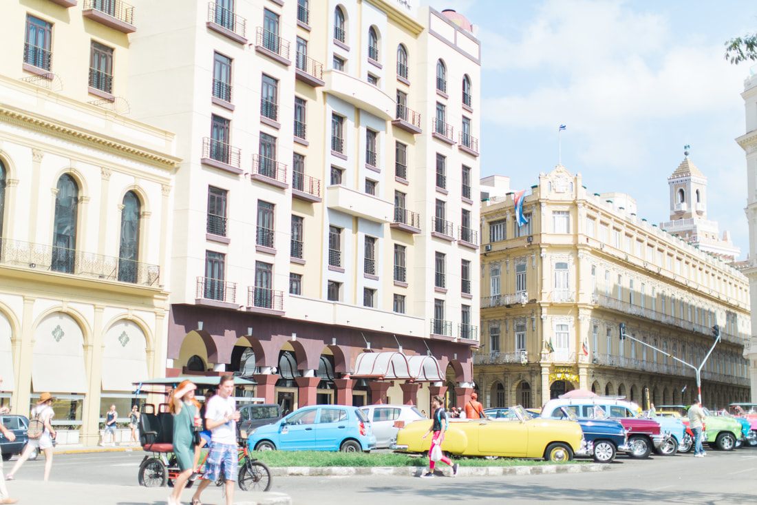 Close-up detail of a restored vintage car in Havana's colorful streets