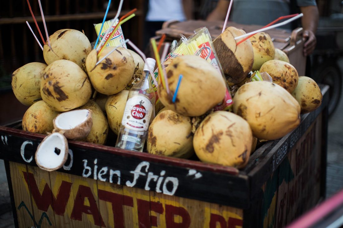 Local life on a narrow cobblestone street in Old Havana, Cuba