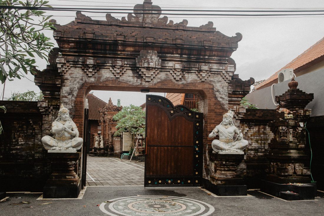 Stone carvings and jungle canopy at the Sacred Monkey Forest Sanctuary