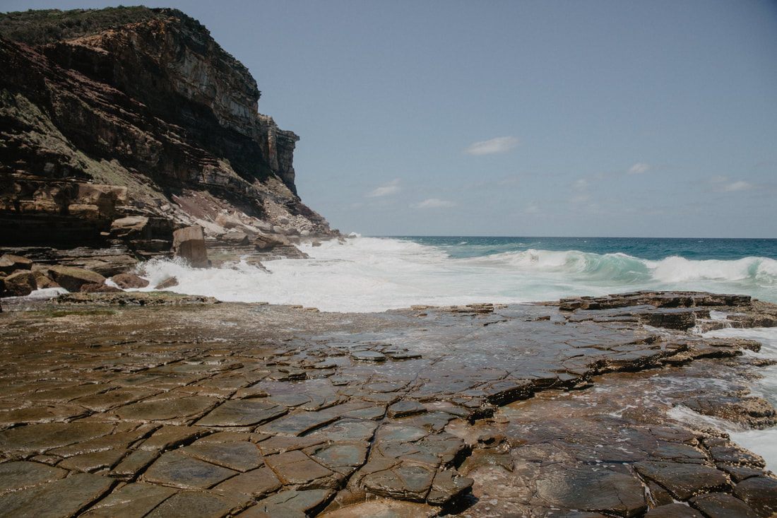 Turquoise water pooling in the rocks along the Royal National Park coastline
