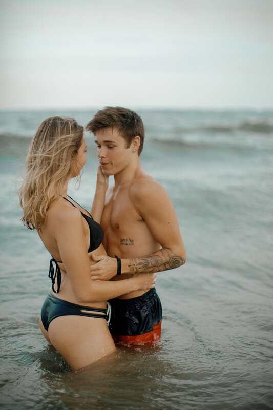 Angela and Bren pausing for a quiet portrait on the sandy shore