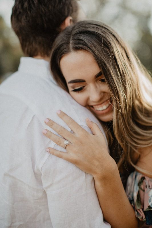 Close-up engagement portrait of Chase and Mitch in soft Charleston light.