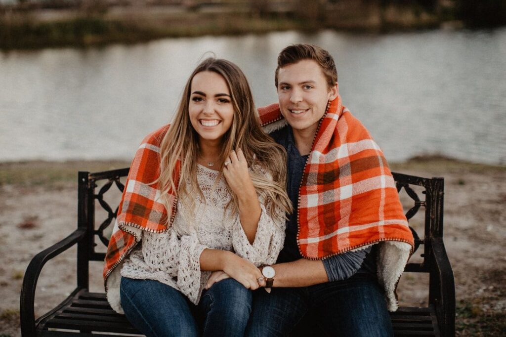 Chase and Mitch embrace during a candid moment of their engagement shoot.