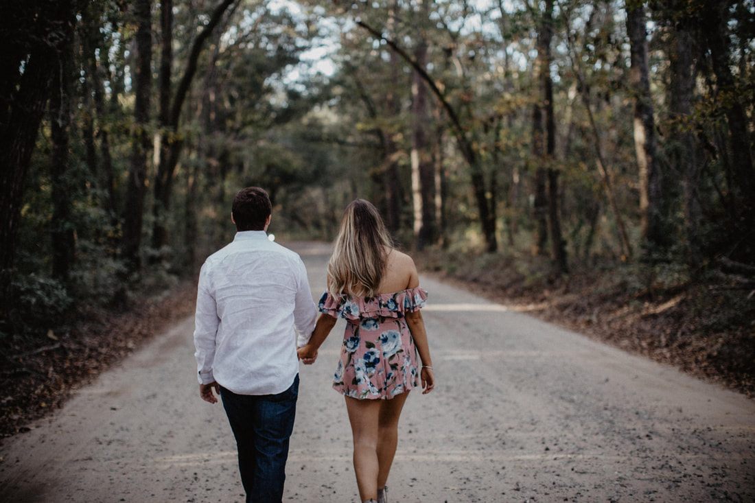 Chase and Mitch smile together during their Lowcountry engagement session.