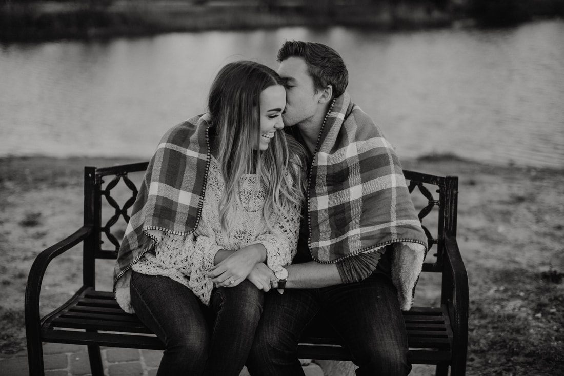 Close-up engagement portrait of Chase and Mitch in soft Charleston light.