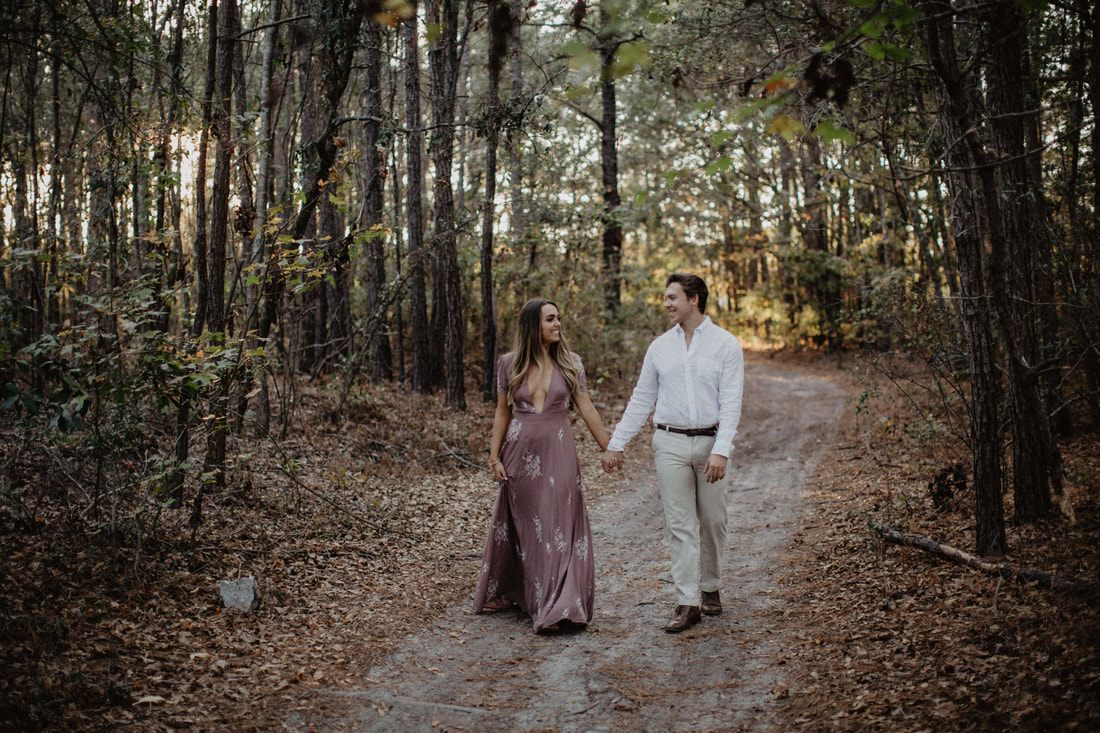 Chase and Mitch smile together during their Lowcountry engagement session.