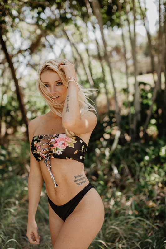 Movement shot of a Cheeky Swim bikini look on the Byron Bay shoreline