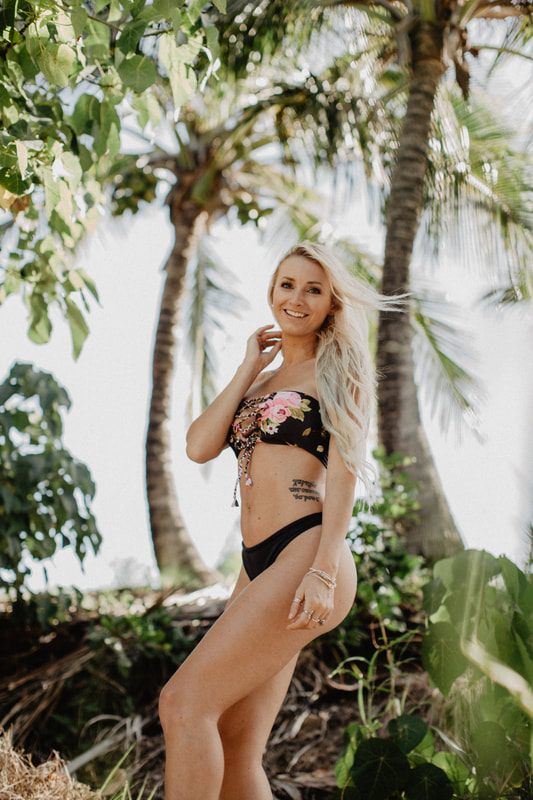Movement shot of a Cheeky Swim bikini look on the Byron Bay shoreline