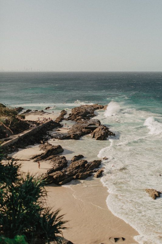 Photo of surfers paddling out at a Gold Coast break along the Gold Coast between Brisbane and Byron Bay, Australia