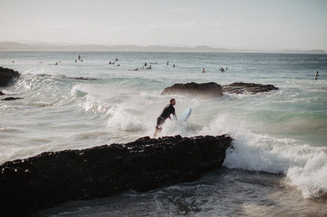 Photo of golden sand and turquoise surf along the Gold Coast between Brisbane and Byron Bay, Australia