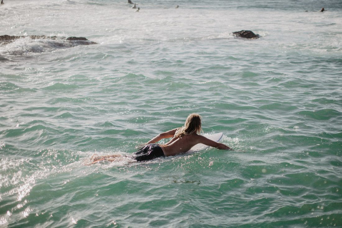 Photo of surfers paddling out at a Gold Coast break along the Gold Coast between Brisbane and Byron Bay, Australia