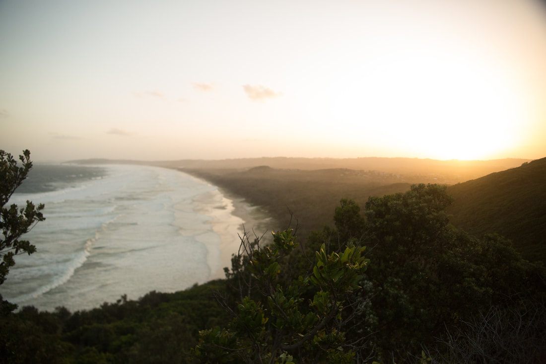 Photo of a lighthouse perched above the rocky coastline along the Gold Coast between Brisbane and Byron Bay, Australia
