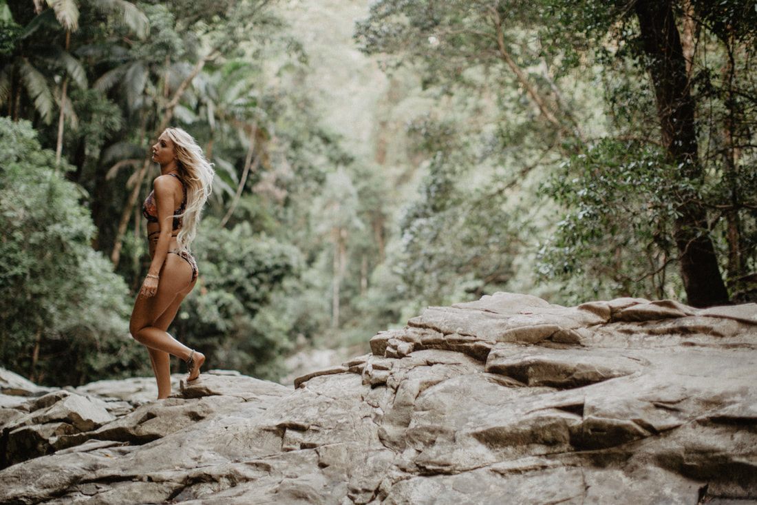 Full-length swimwear portrait against the calm Currumbin, Gold Coast shoreline
