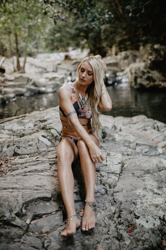 Candid beach portrait in Strange Bikinis along the quiet Currumbin coastline