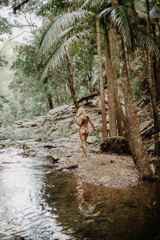 Candid beach portrait in Strange Bikinis along the quiet Currumbin coastline