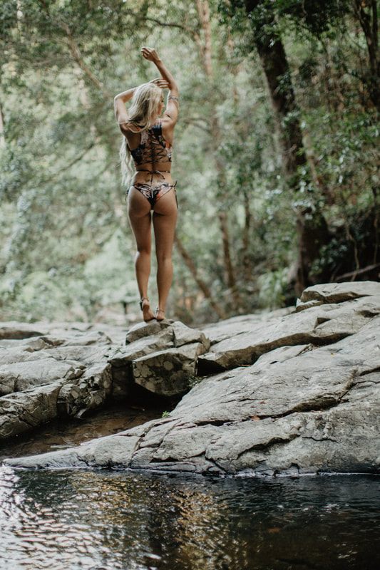 Candid beach portrait in Strange Bikinis along the quiet Currumbin coastline