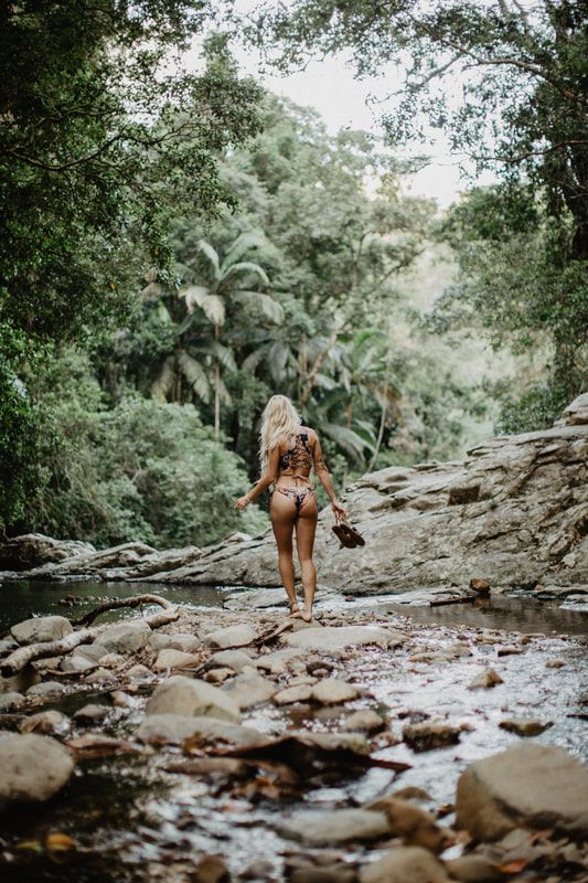 Walking along the shoreline in Strange Bikinis near Currumbin, Australia