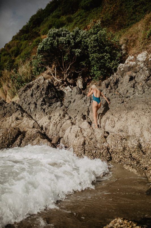 A styled swimwear portrait shot on the ferry ride out to Waiheke Island
