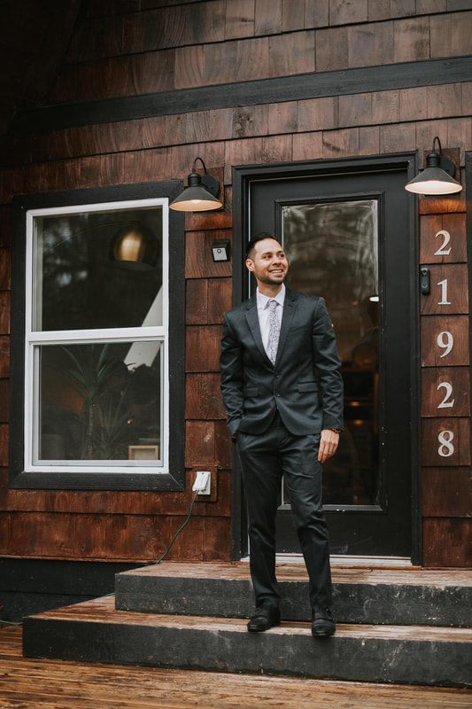Couple embracing under string lights at their celestial-themed elopement