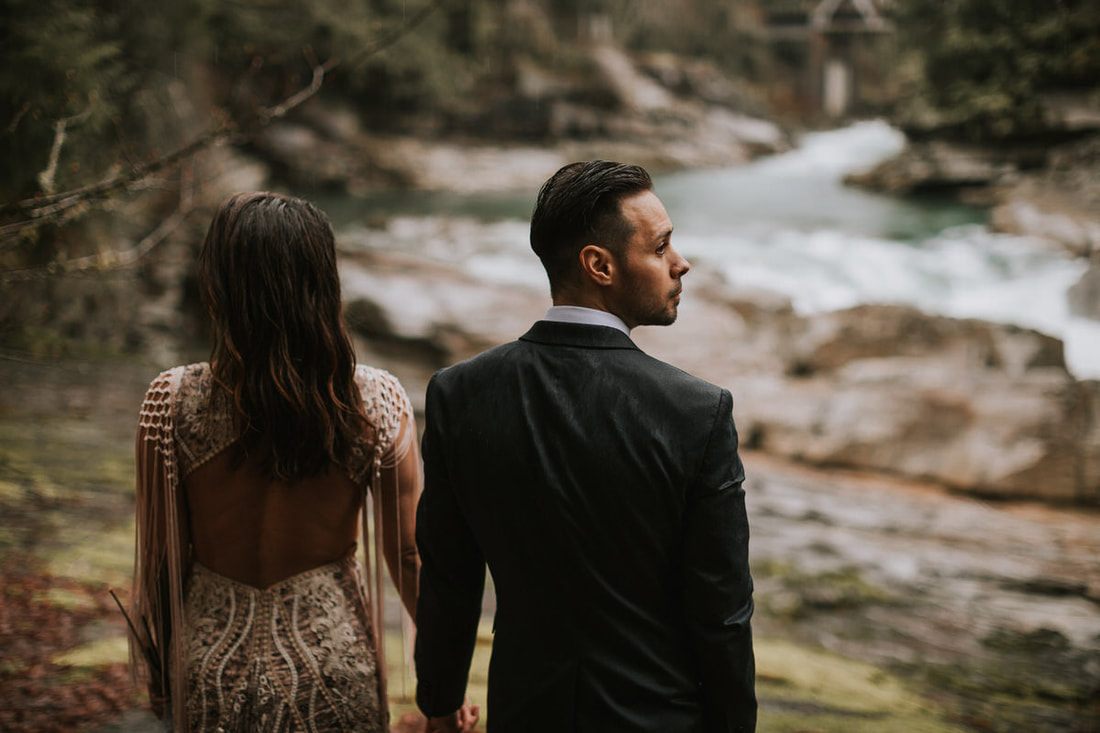 Couple sharing a first dance under twinkling lights at the cabin