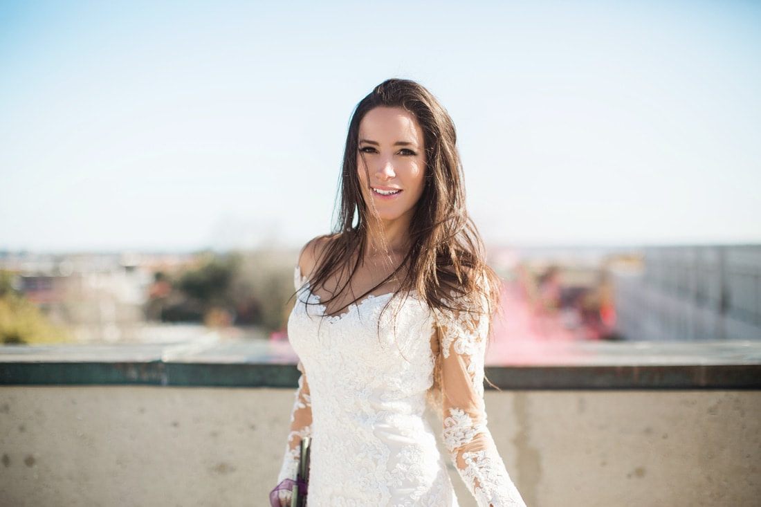 Olivia walks along a historic Charleston street during her bridal portrait session.