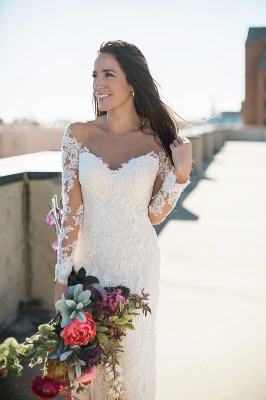 Olivia smiles softly for a romantic bridal portrait in Charleston, SC.