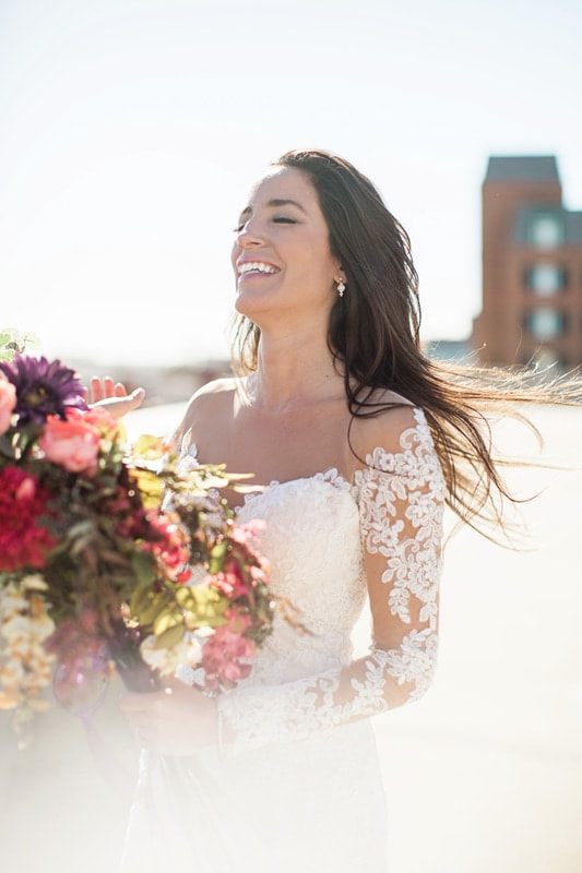 A close-up of Olivia's bridal jewelry and hair detail in Charleston.