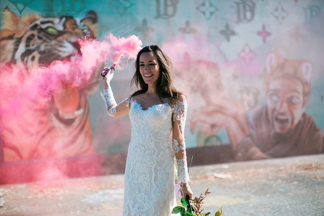 Olivia walks along a historic Charleston street during her bridal portrait session.