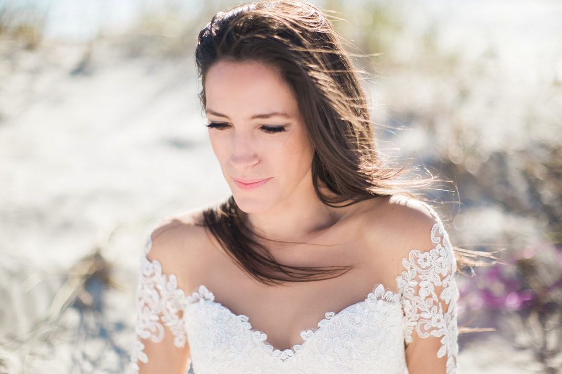 Olivia's gown train fans out in a classic Charleston bridal portrait.