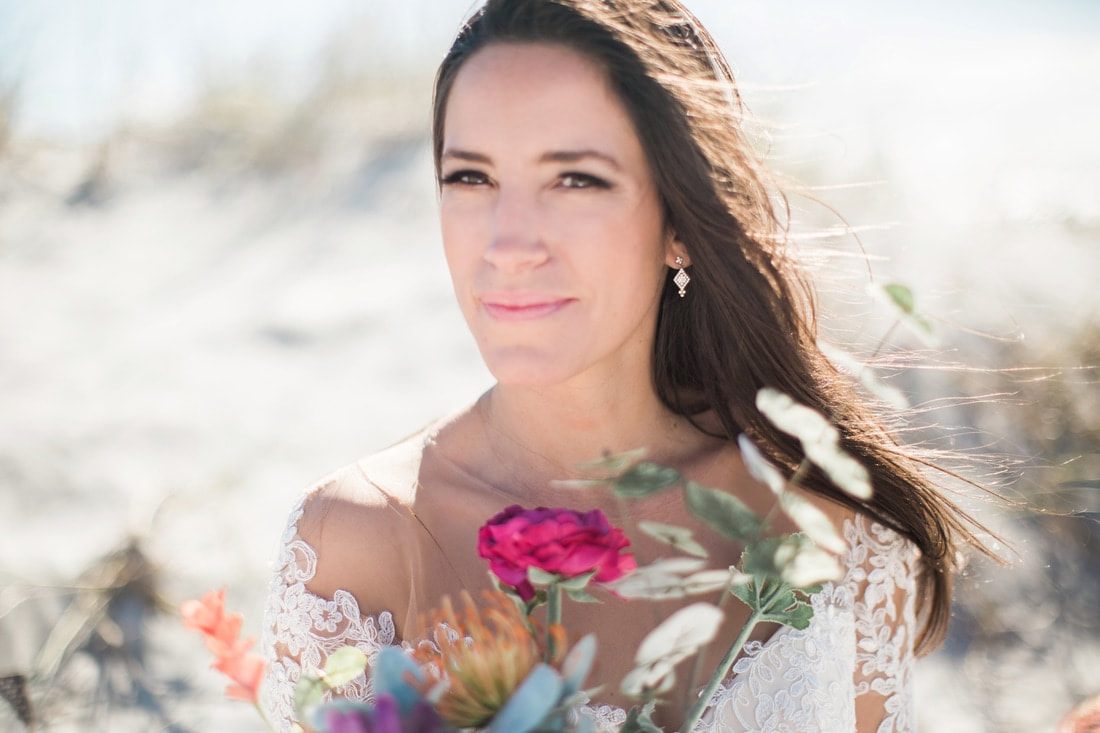 Olivia poses against cobblestone streets for her Charleston bridal portraits.